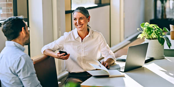 banker speaking with client at desk